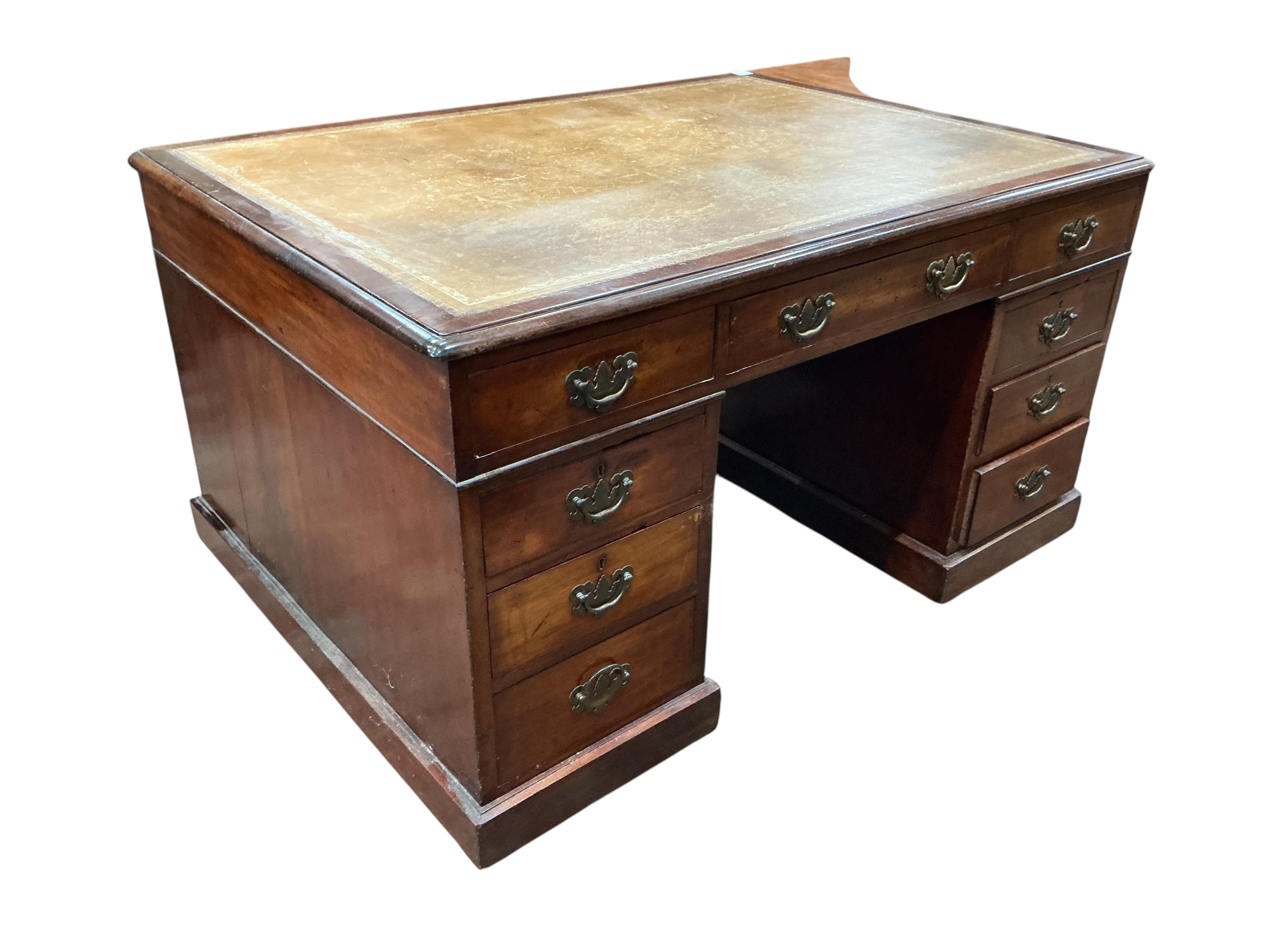 A late Victorian mahogany pedestal partner's desk, width 136cm, depth 99cm, height 78cm